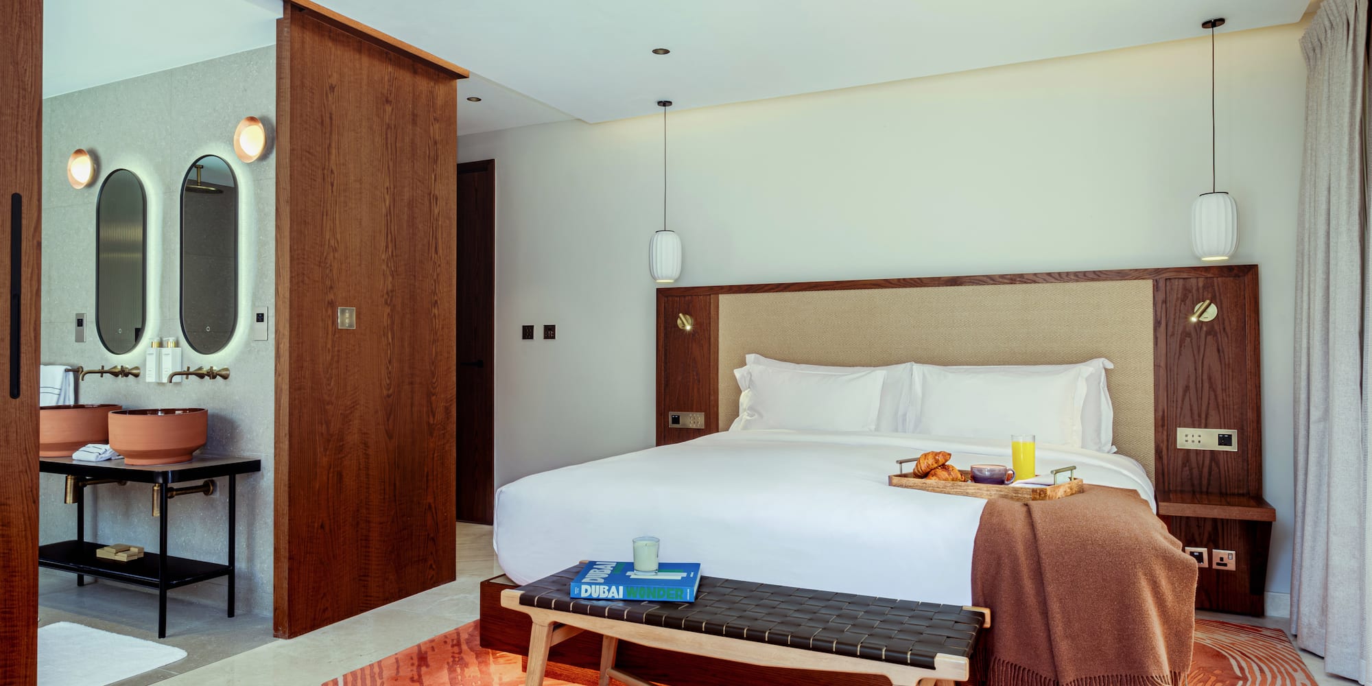 a bed with a tray of food on it