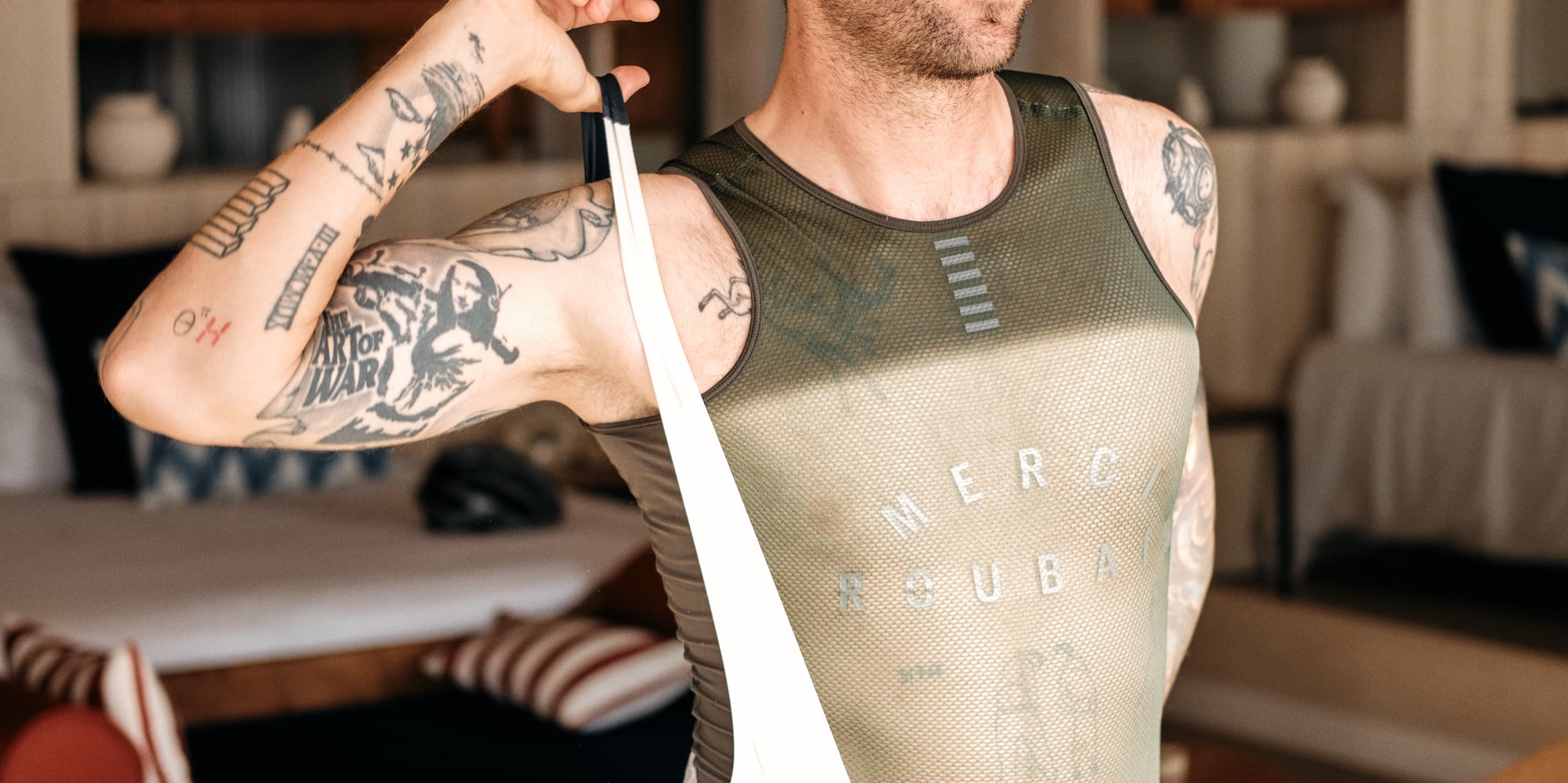 a man in a uniform holding a strap