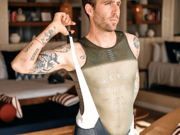 a man in a uniform holding a strap