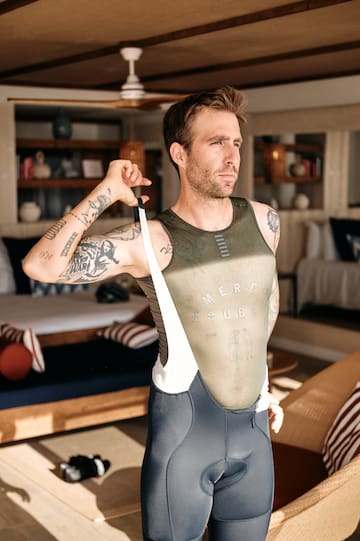 a man in a uniform holding a strap