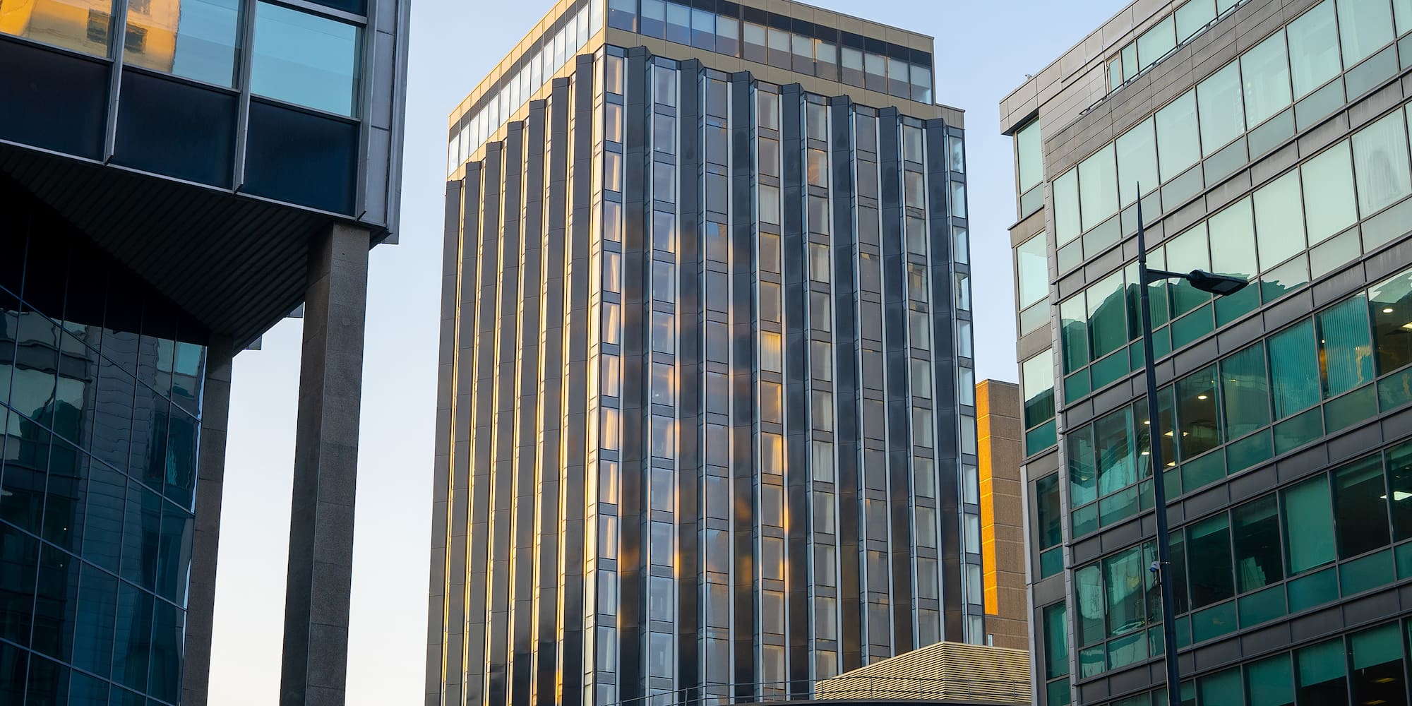 a group of buildings with glass walls