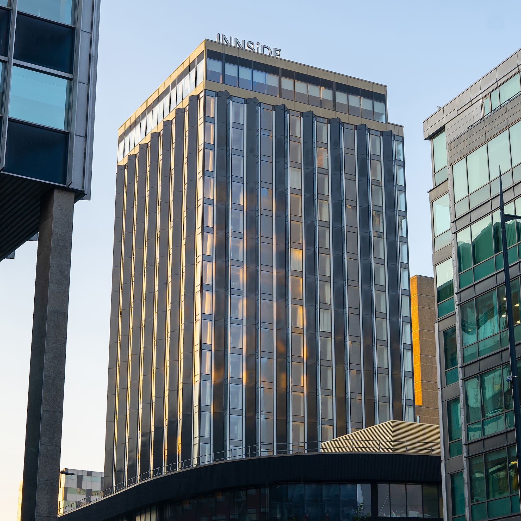 a group of buildings with glass walls