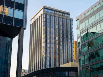 a group of buildings with glass walls