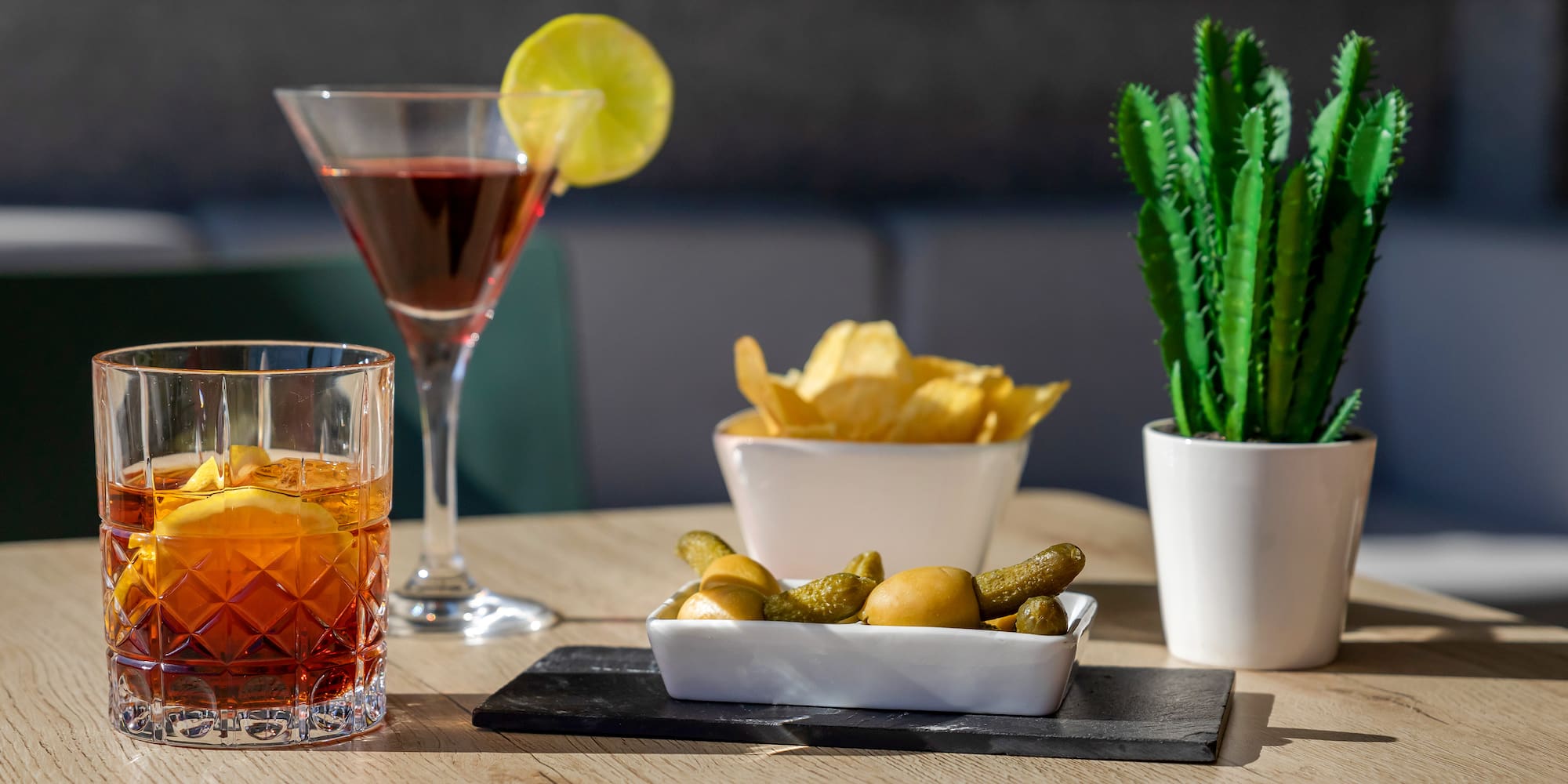 a table with a drink and food on it