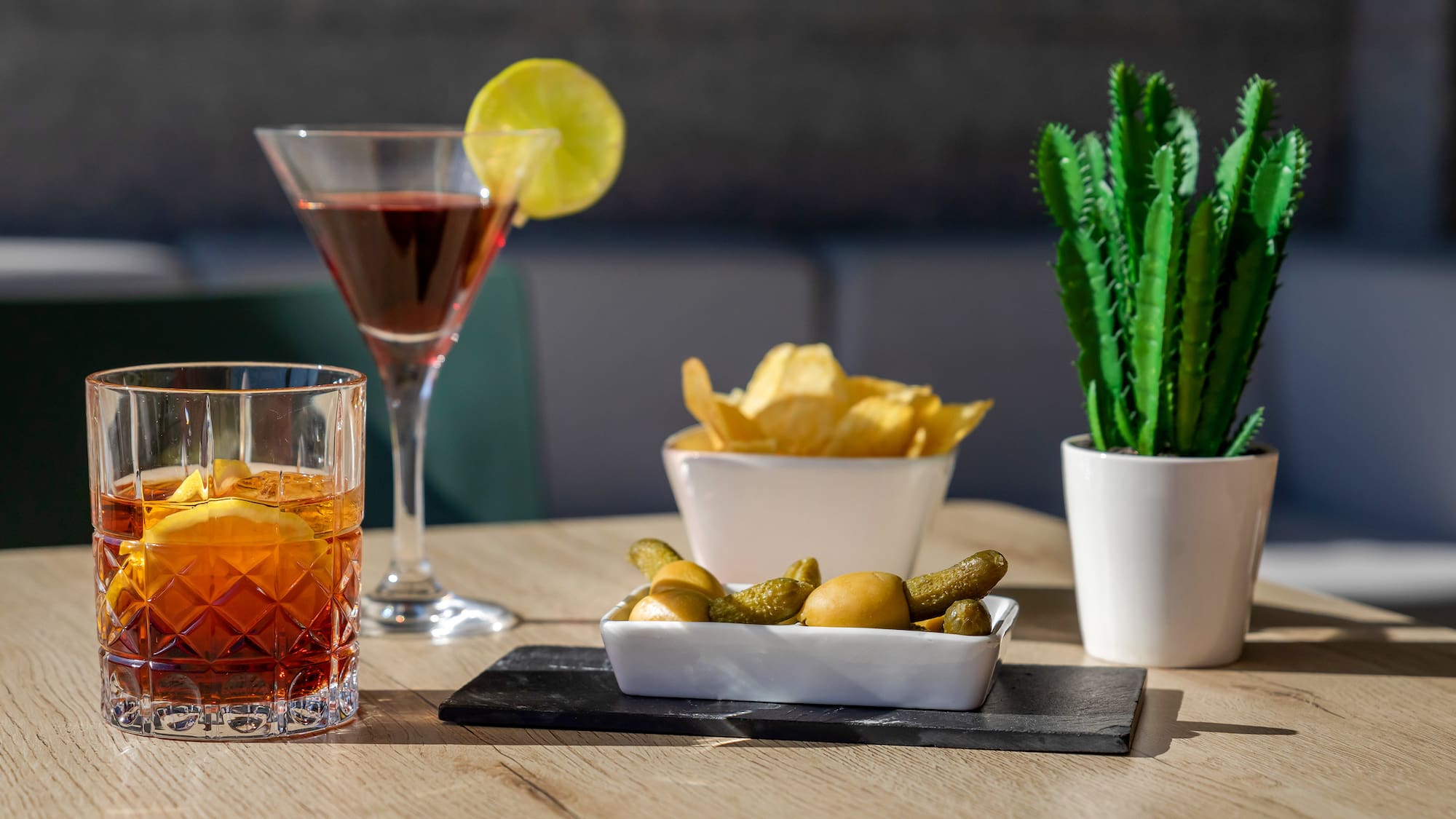 a table with a drink and food on it