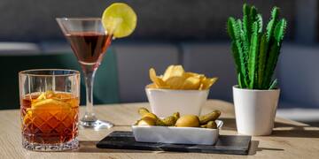 a table with a drink and food on it