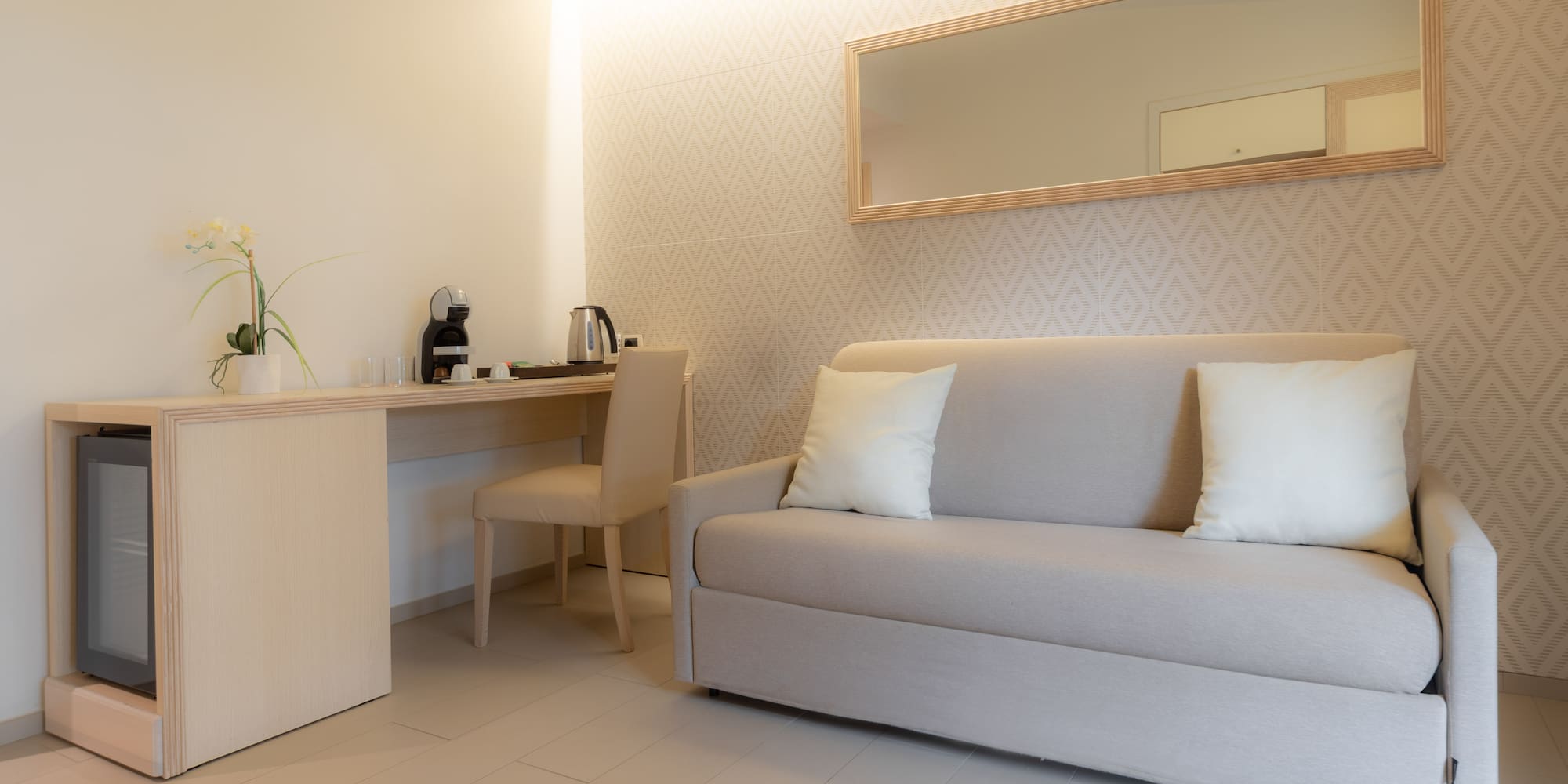 a room with a couch and a mirror