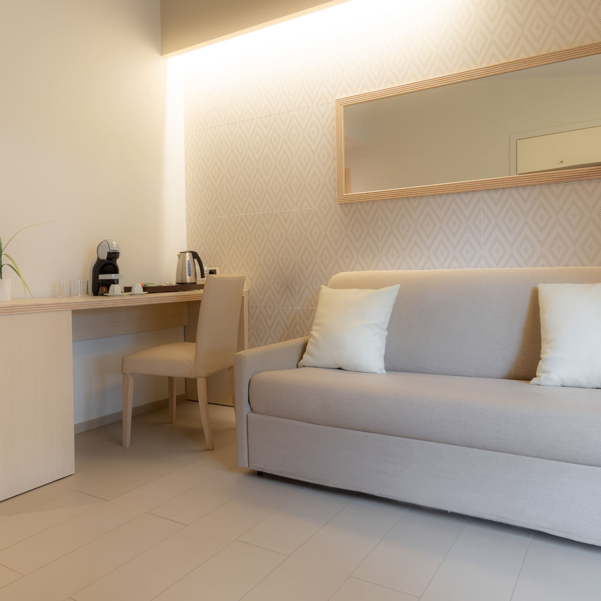 a room with a couch and a mirror