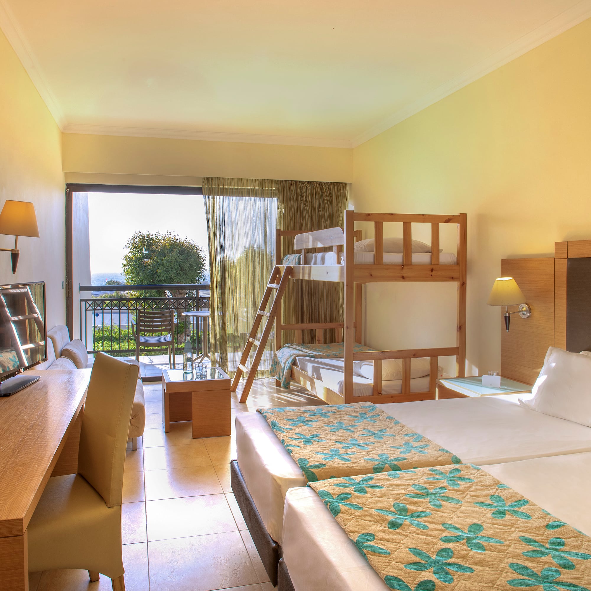 a room with bunk beds and a television