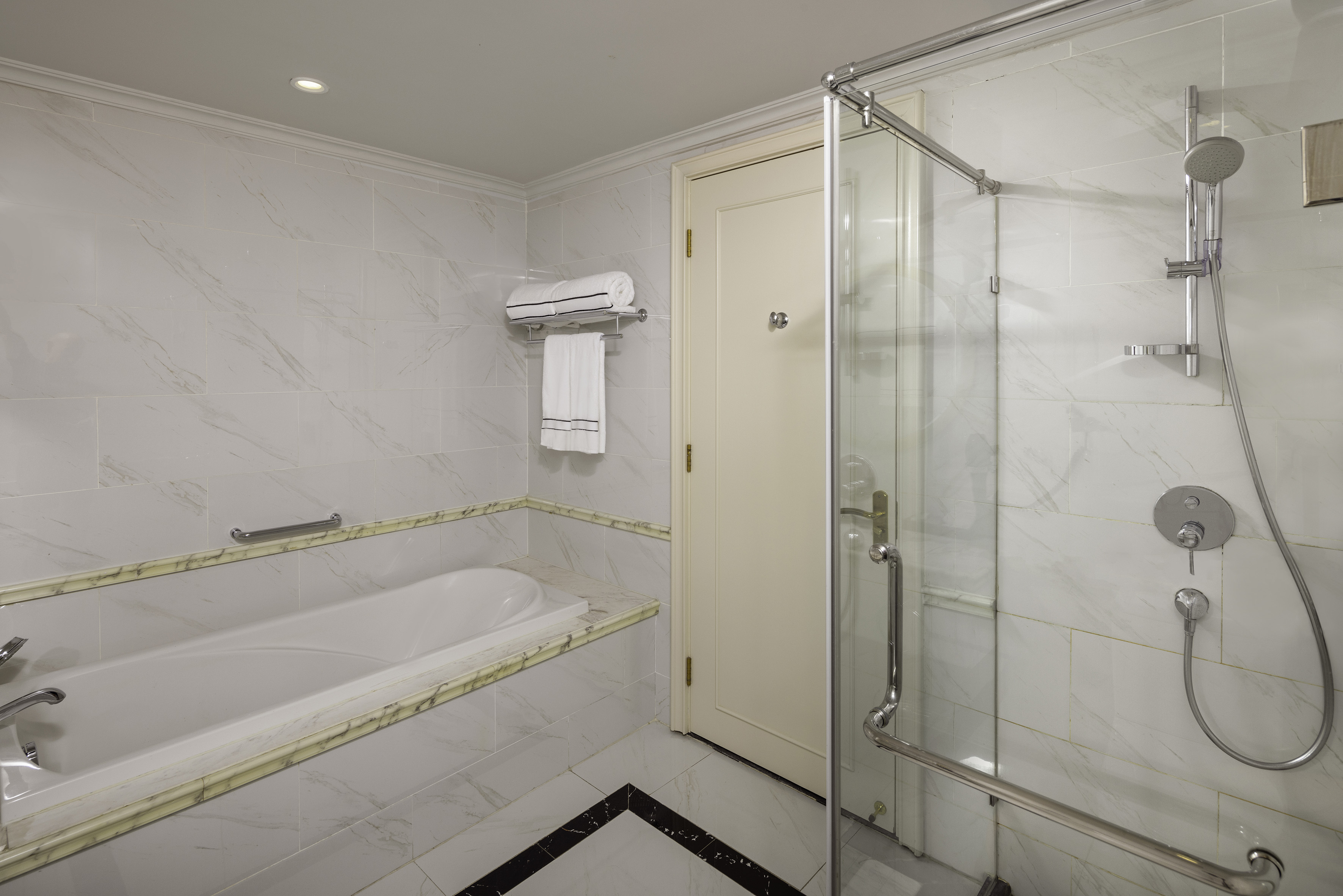 a bathroom with a bathtub and shower