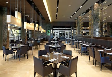 a restaurant with tables and chairs