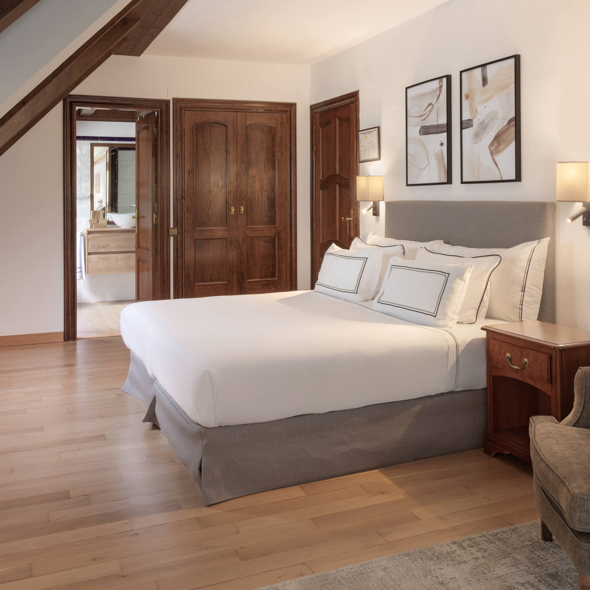 a bedroom with a bed and a chair