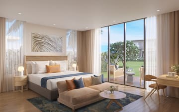 a bedroom with a large bed and a couch