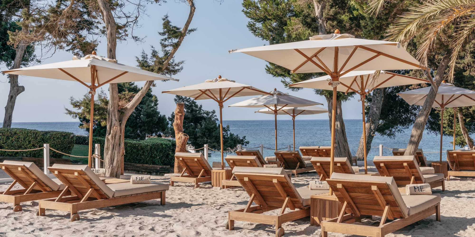a group of chairs and umbrellas on a beach