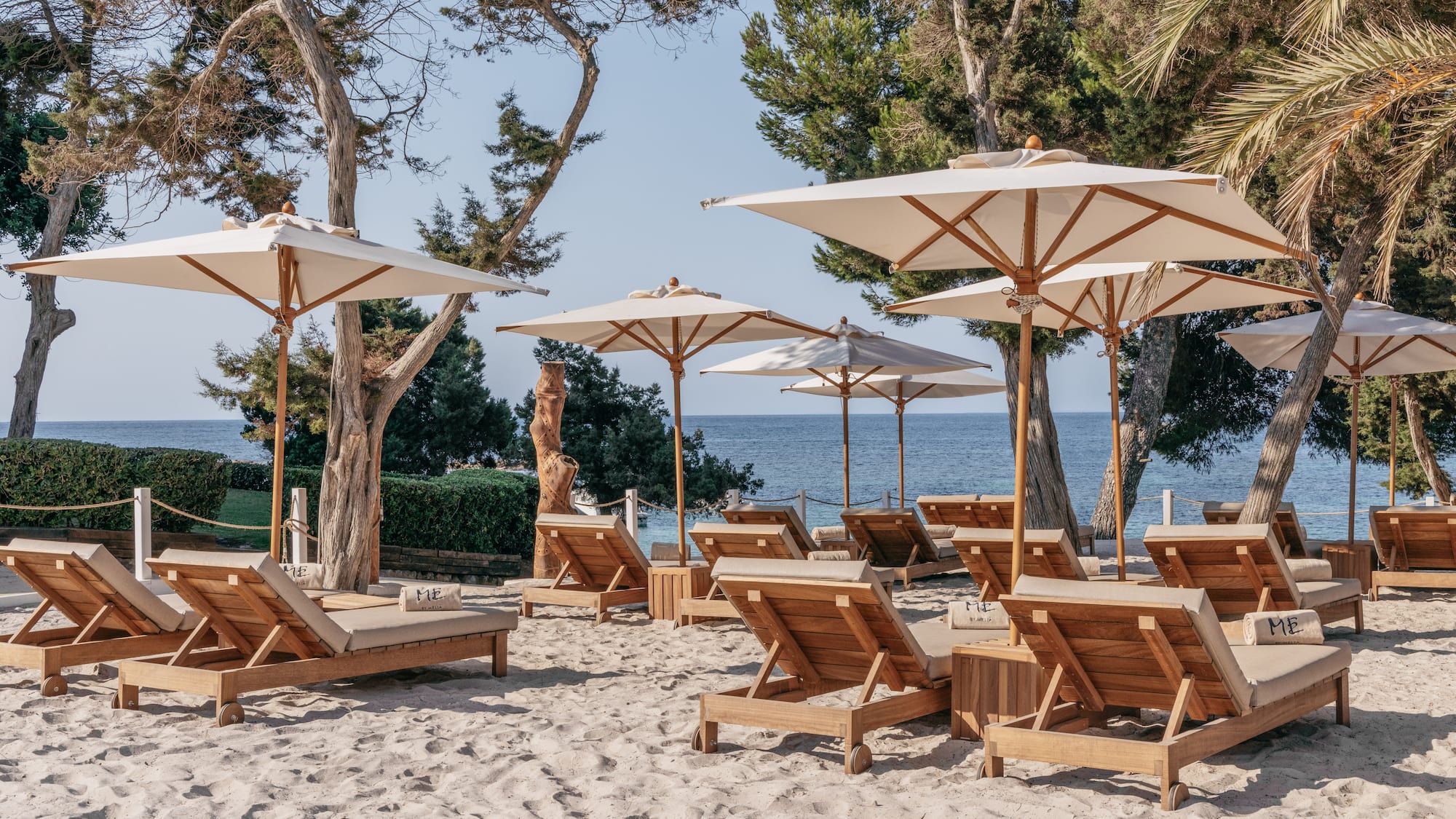 a group of chairs and umbrellas on a beach