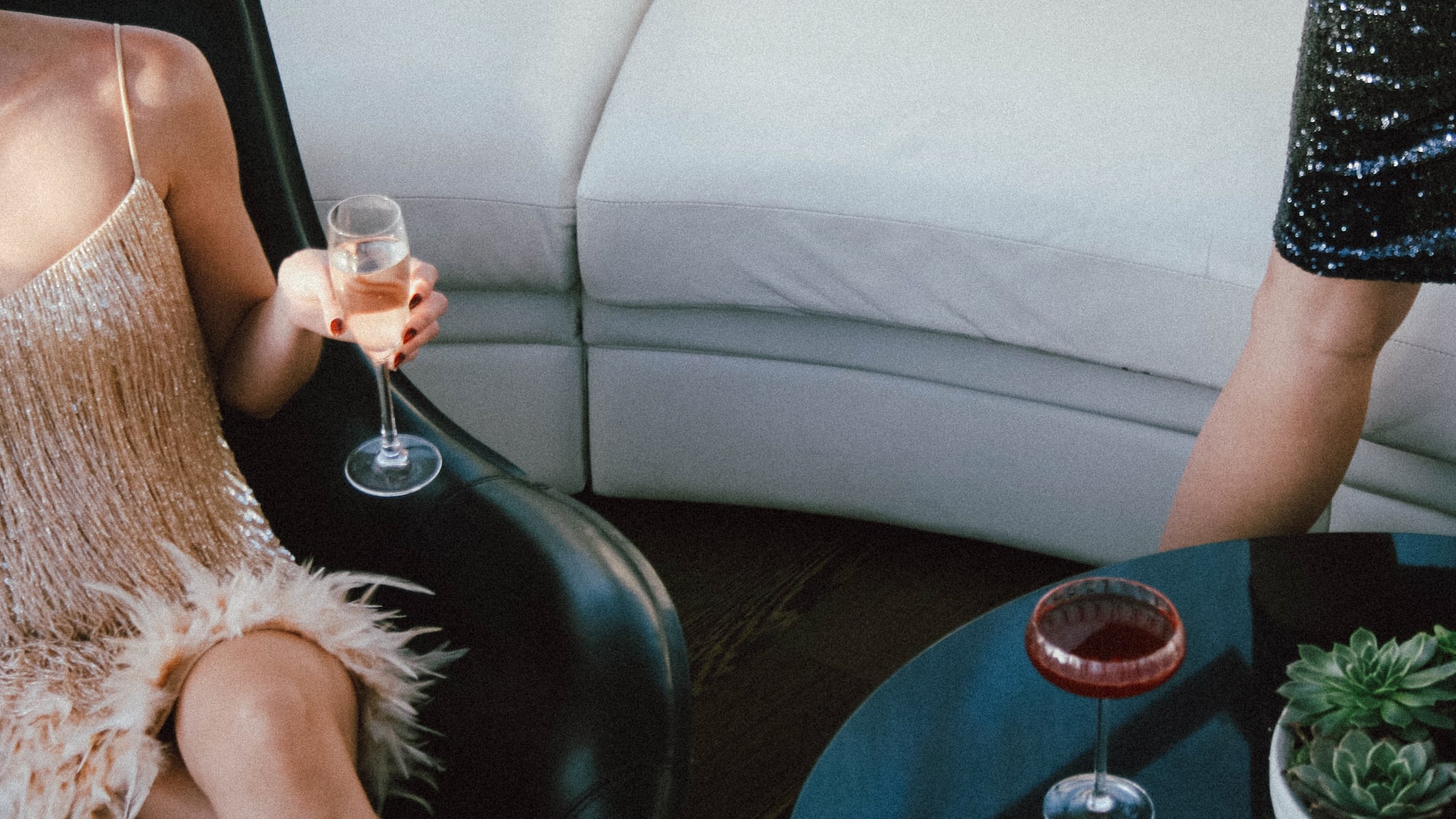 a woman sitting in a chair with drinks
