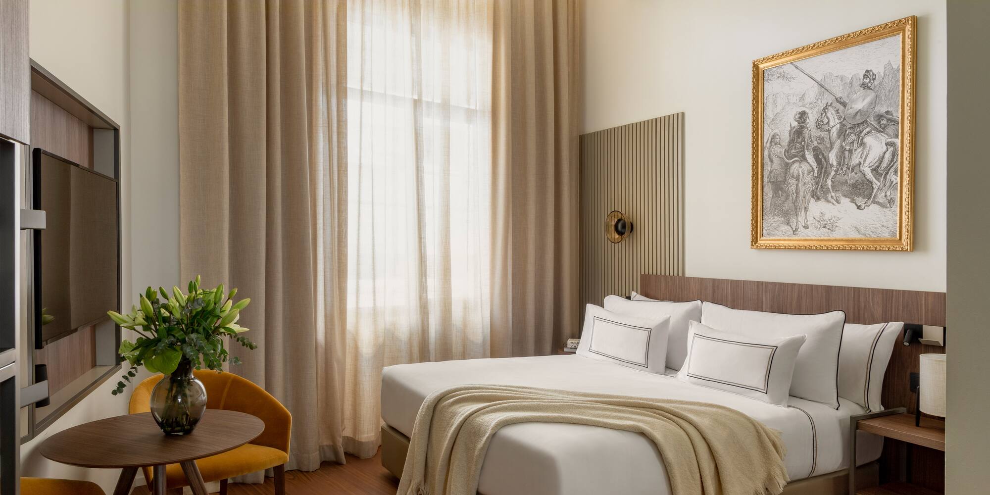 a bedroom with a bed and a chair