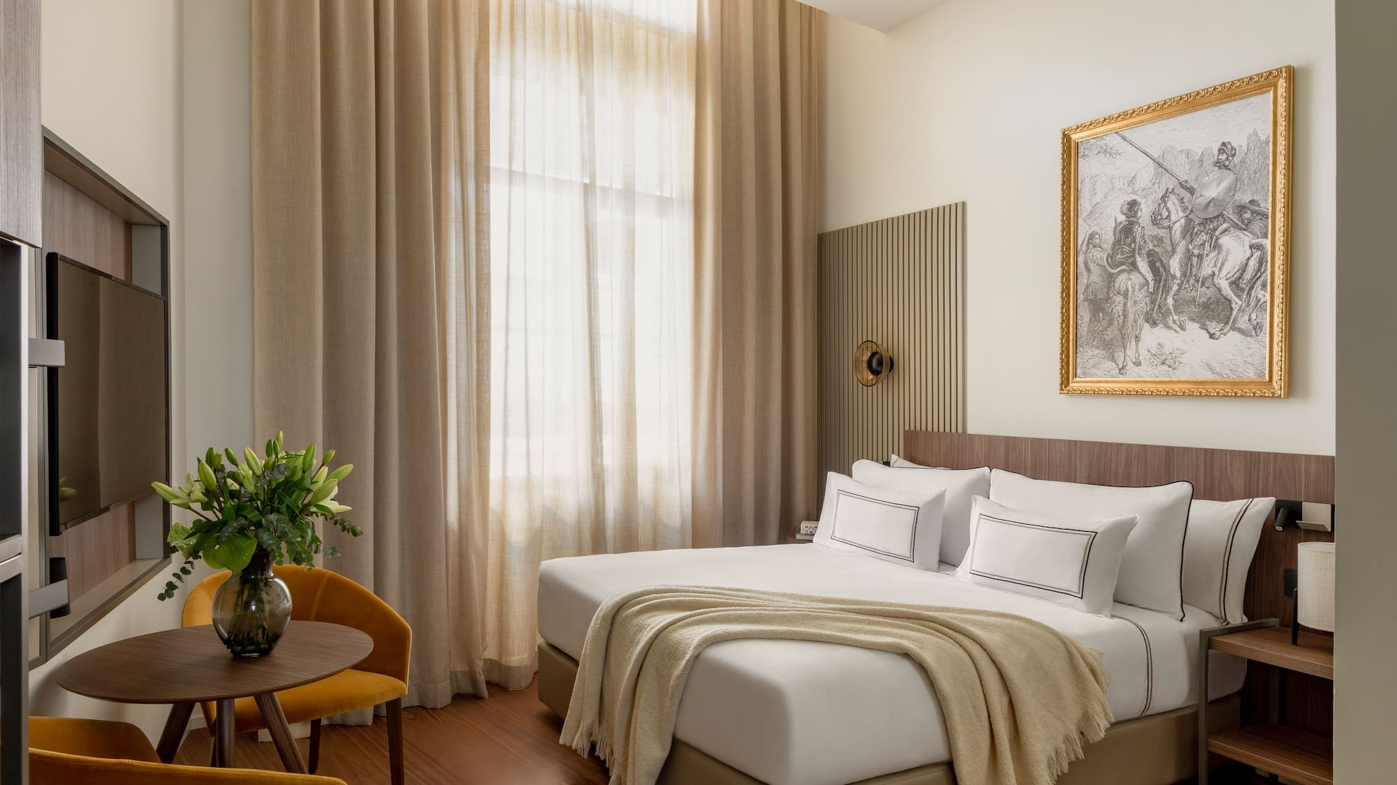 a bedroom with a bed and a chair