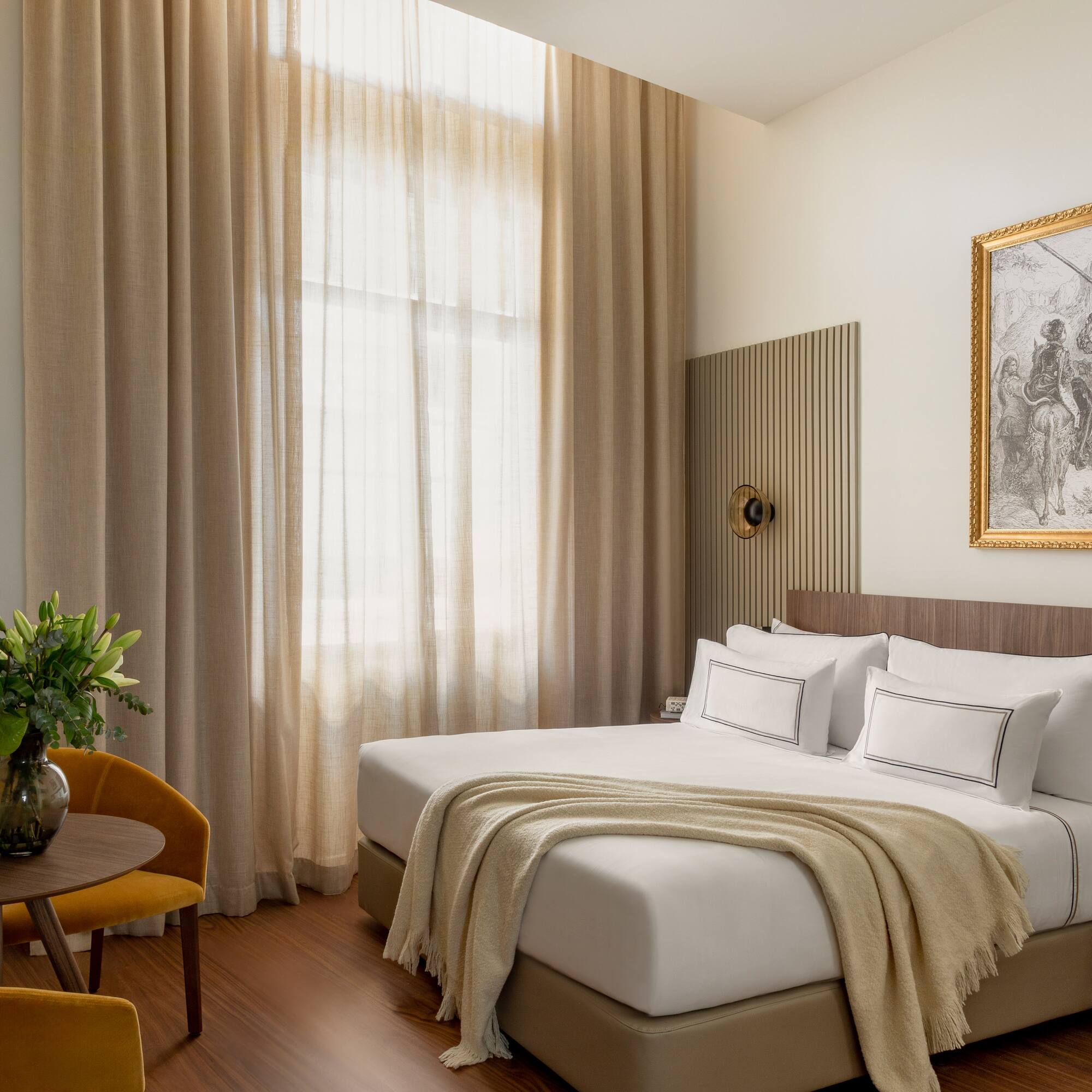 a bedroom with a bed and a chair