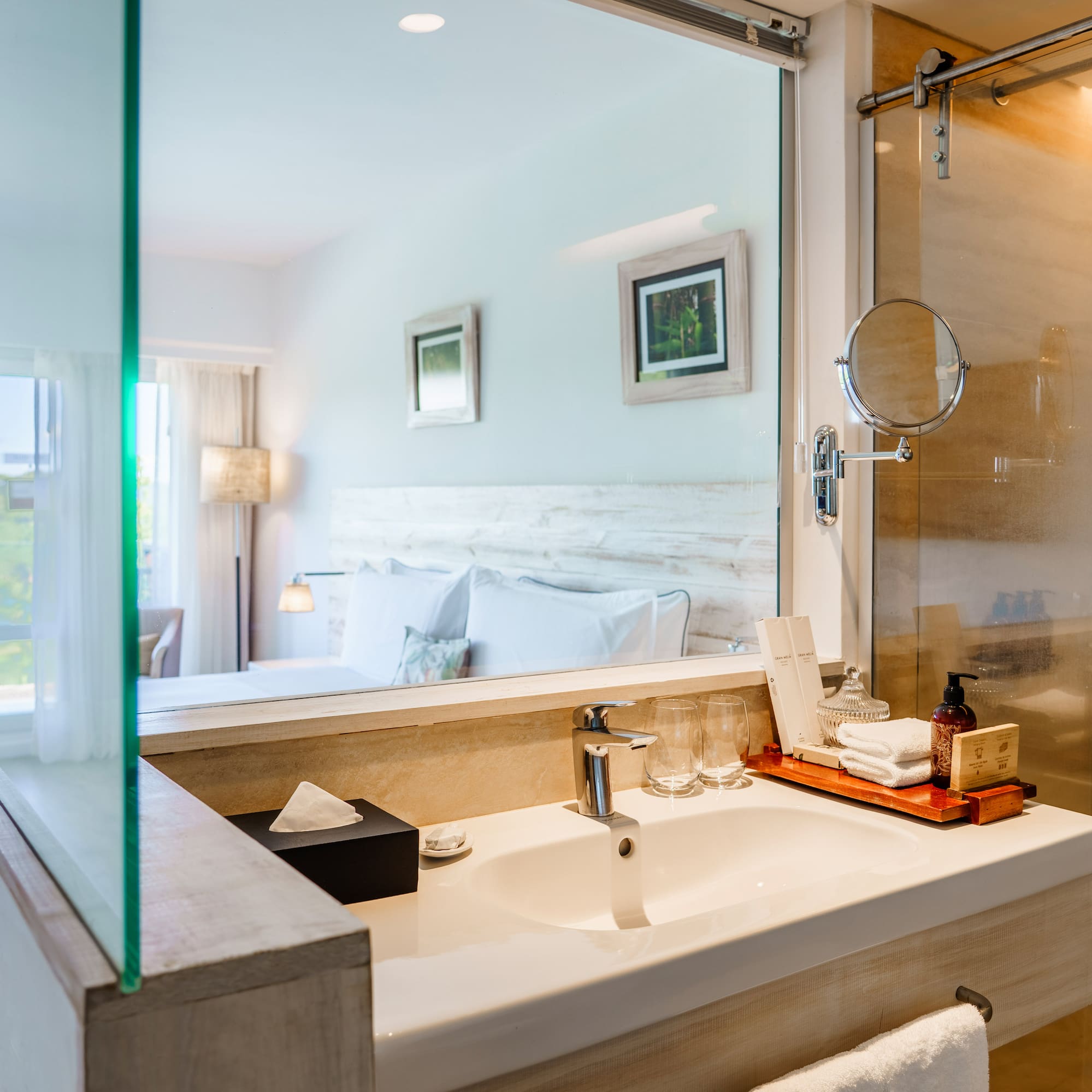a bathroom with a glass shower door