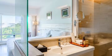 a bathroom with a glass shower door