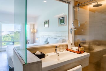 a bathroom with a glass shower door