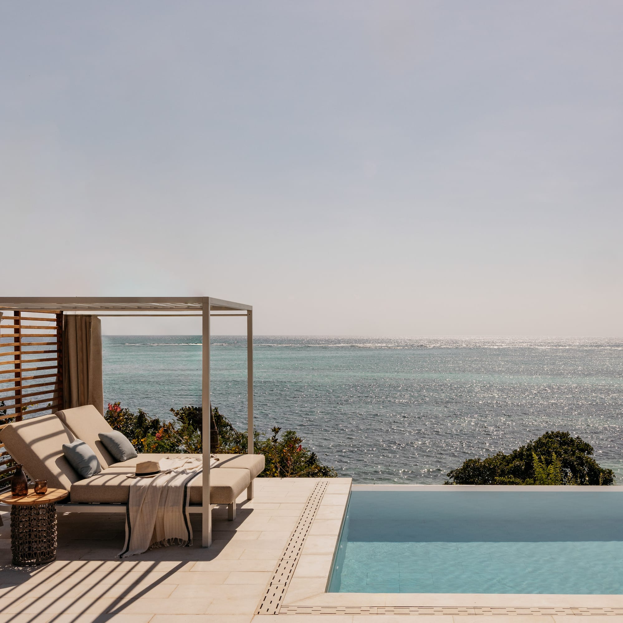 a pool with a bed and a blanket on it