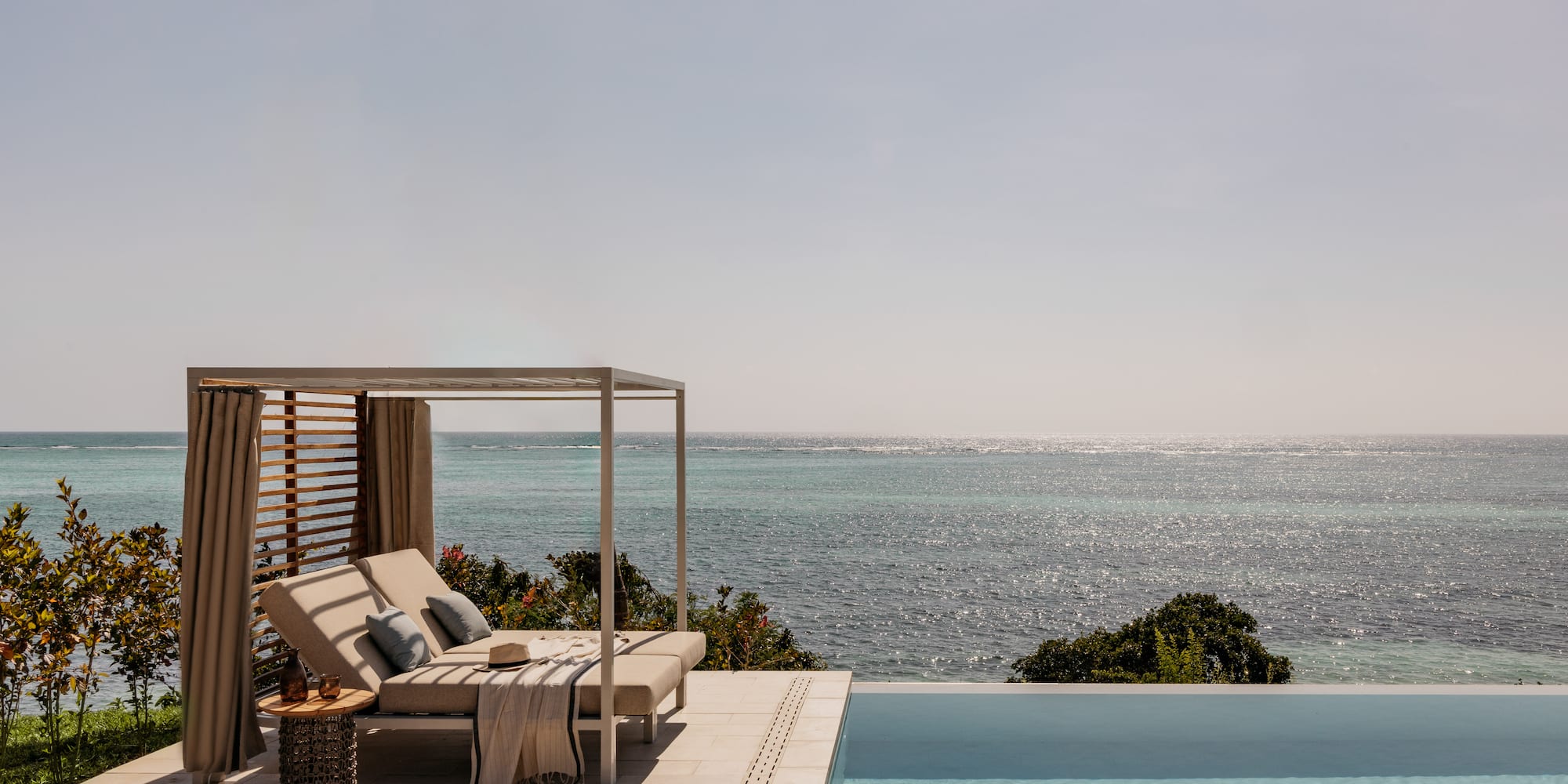 a pool with a bed and a blanket on it