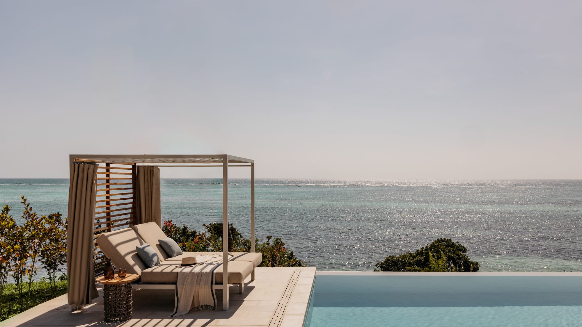 a pool with a bed and a blanket on it