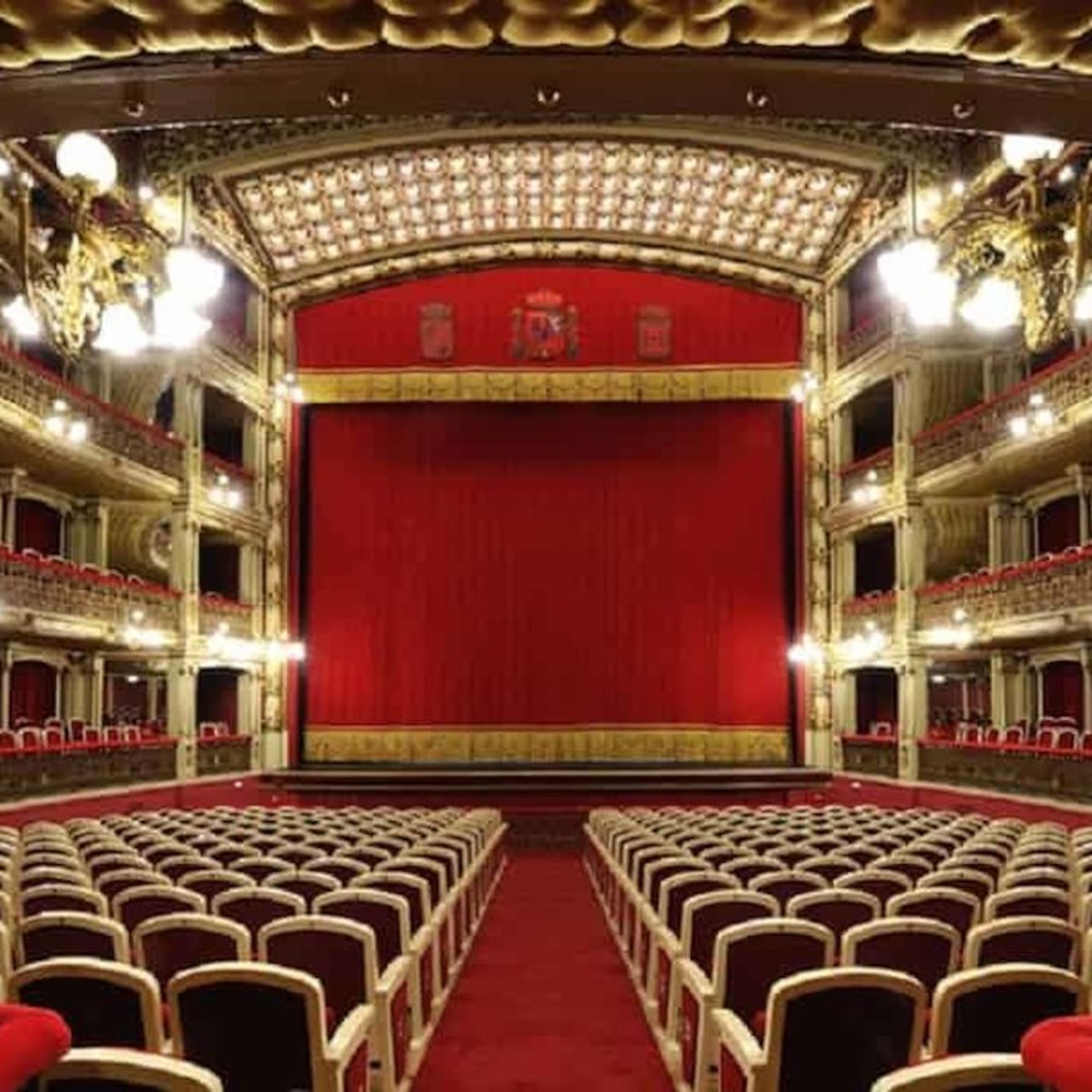 a theater with red curtains and red curtains