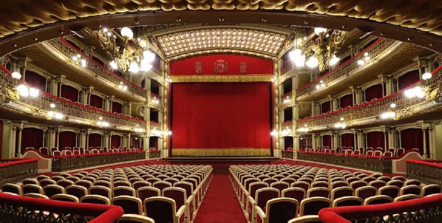 a theater with red curtains and red curtains
