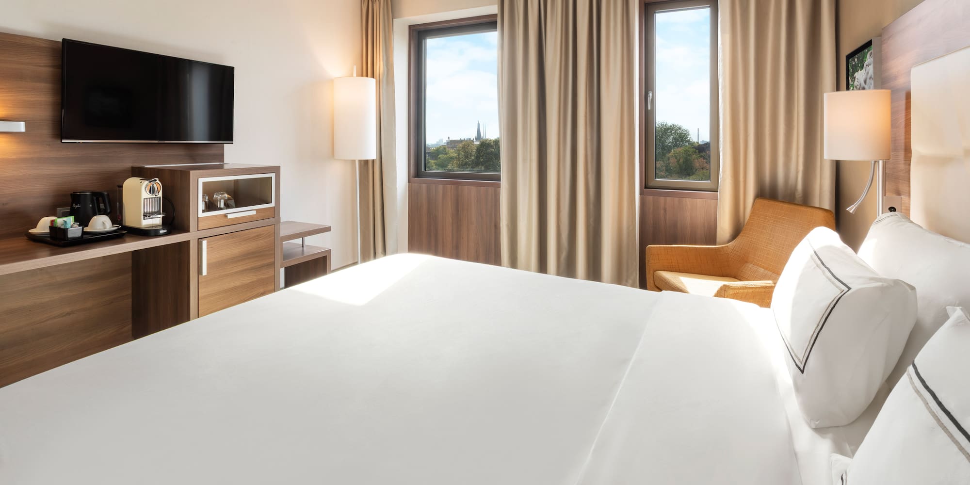 a room with a bed and a television