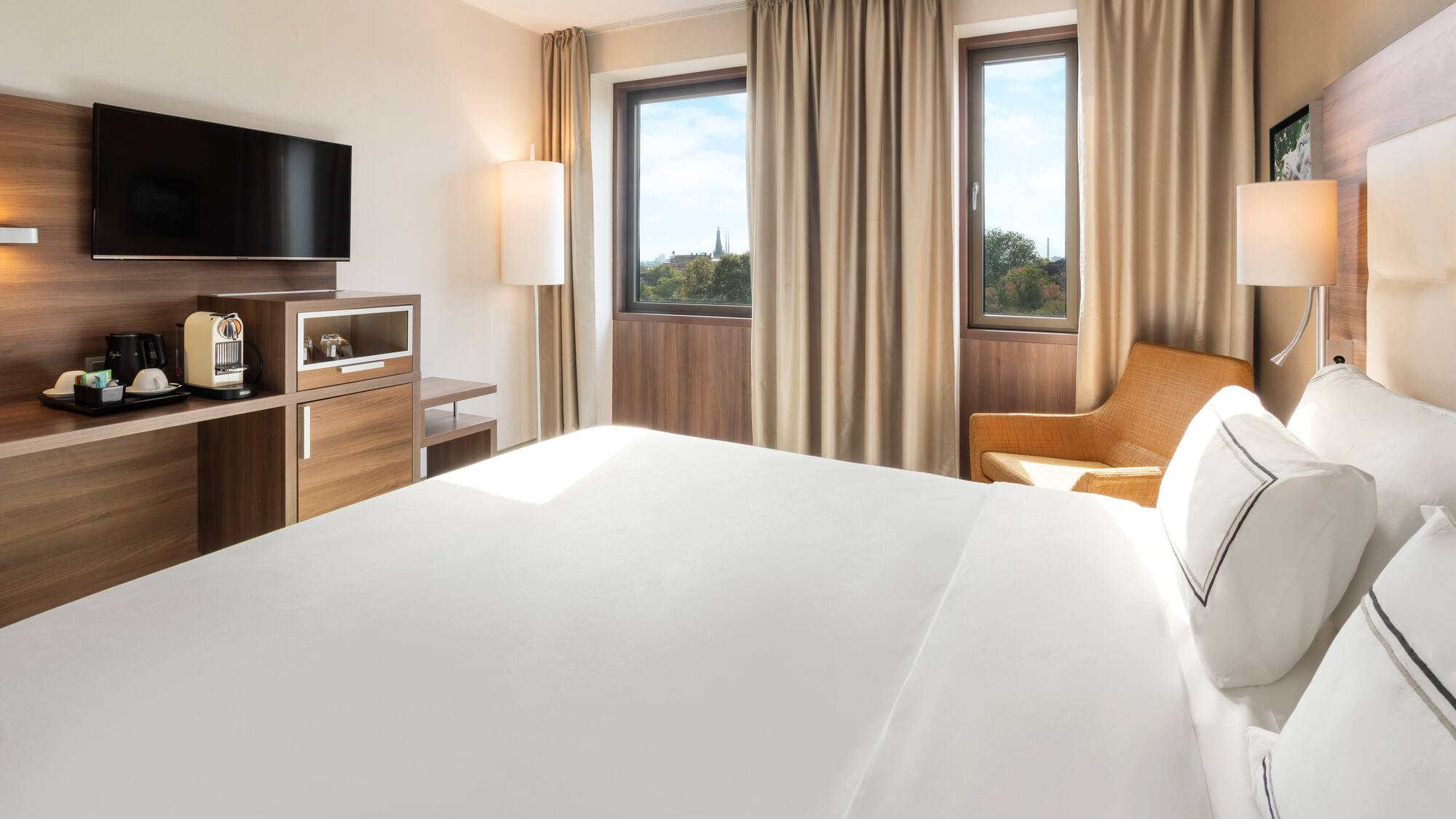 a room with a bed and a television