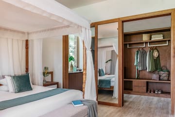 Premium Terrace room with a bed and closets at Melia Zanzibar Hotel