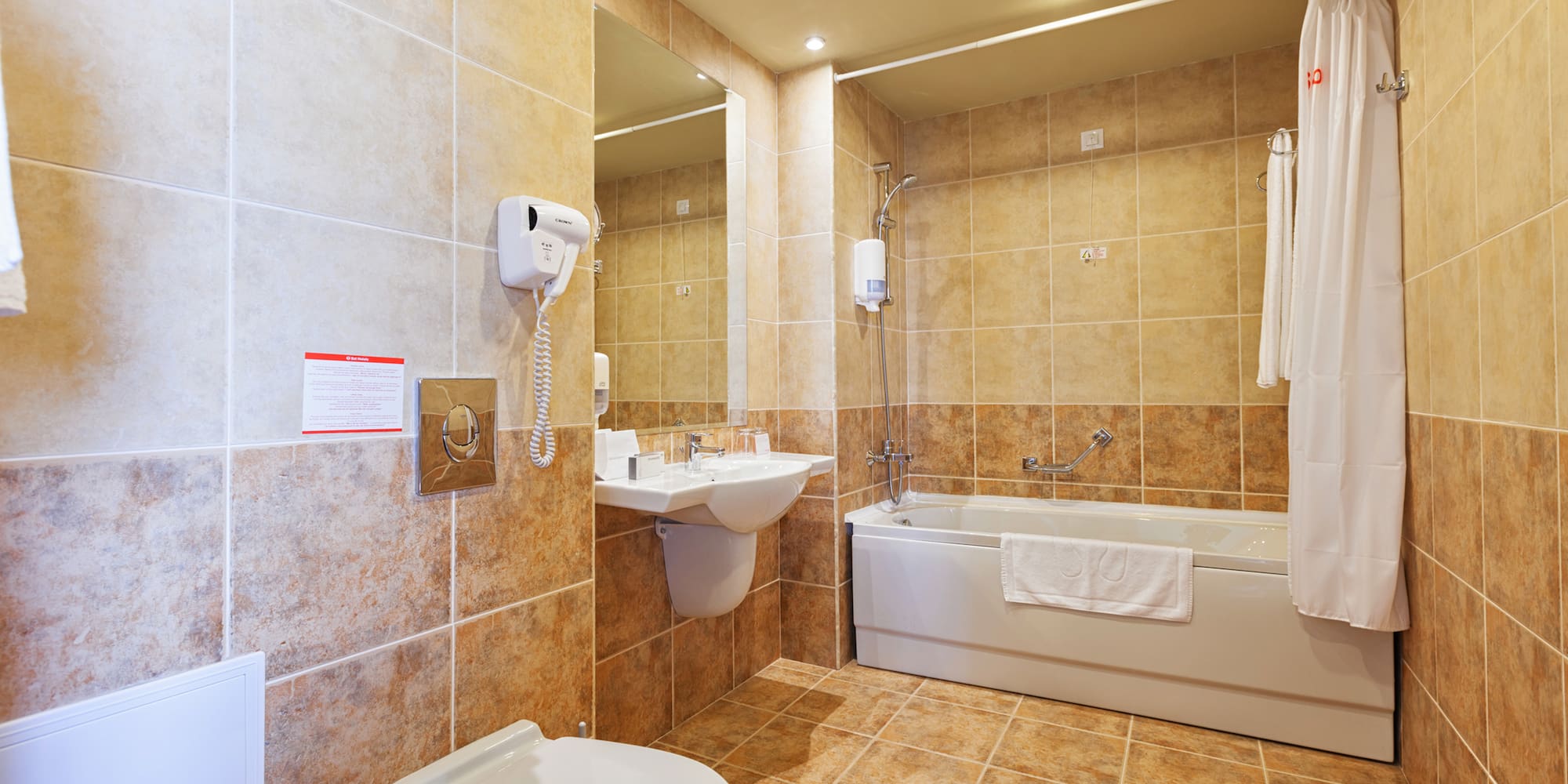 a bathroom with a toilet and sink