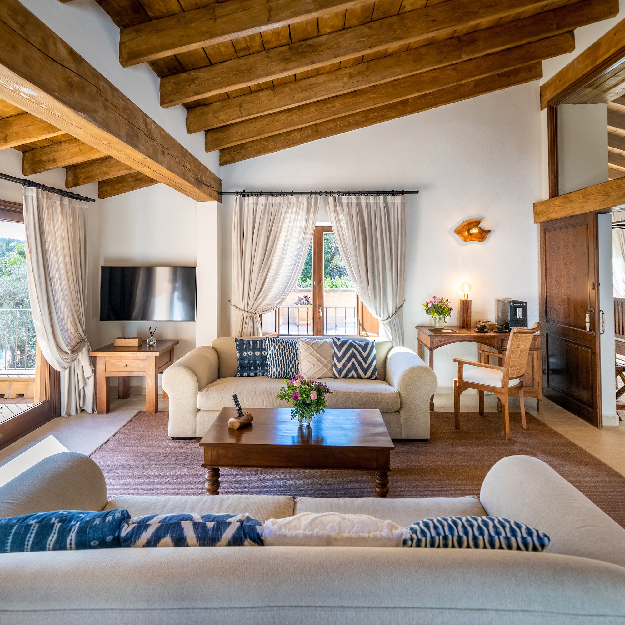 a living room with a couch and a table