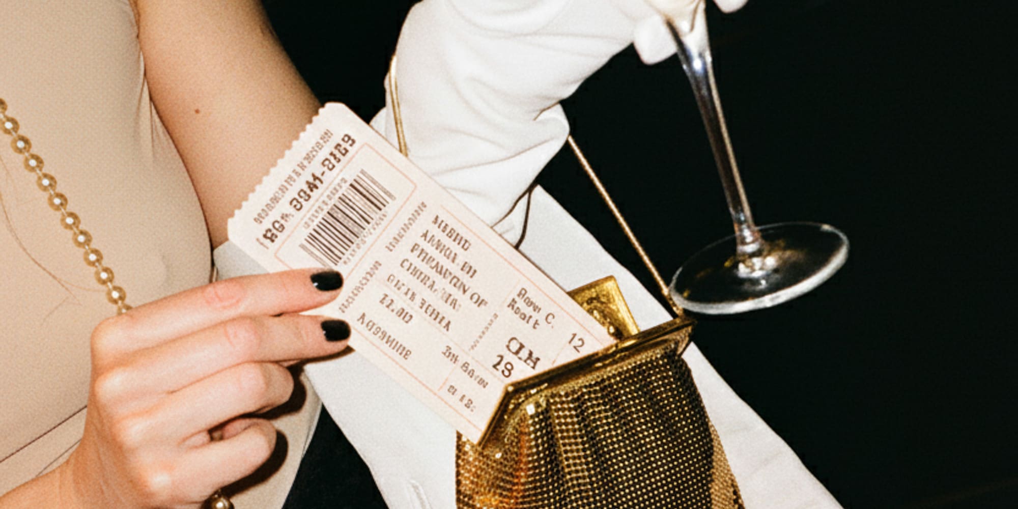 a woman holding a wine glass and a ticket
