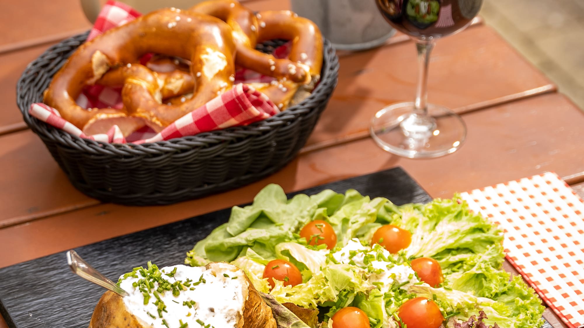 a plate of food and a glass of wine