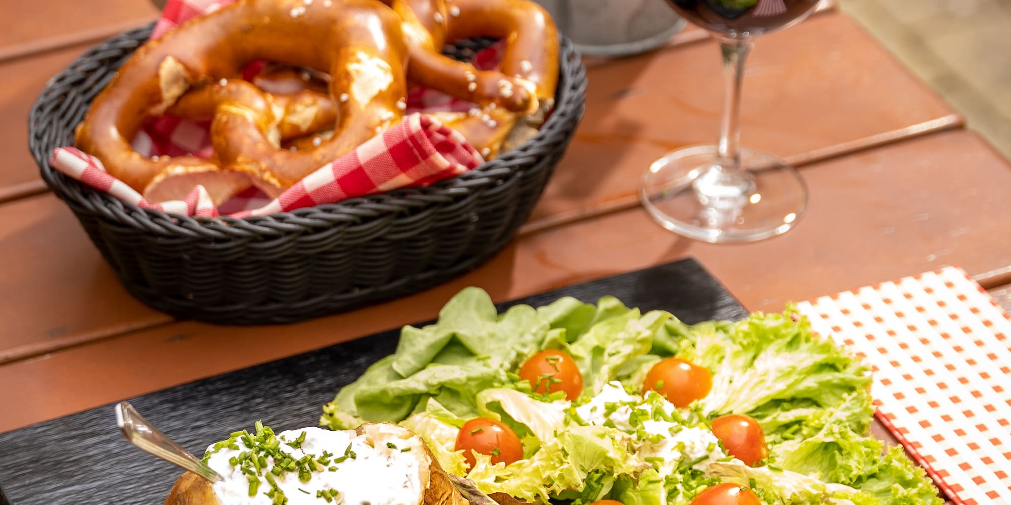 a plate of food and a glass of wine