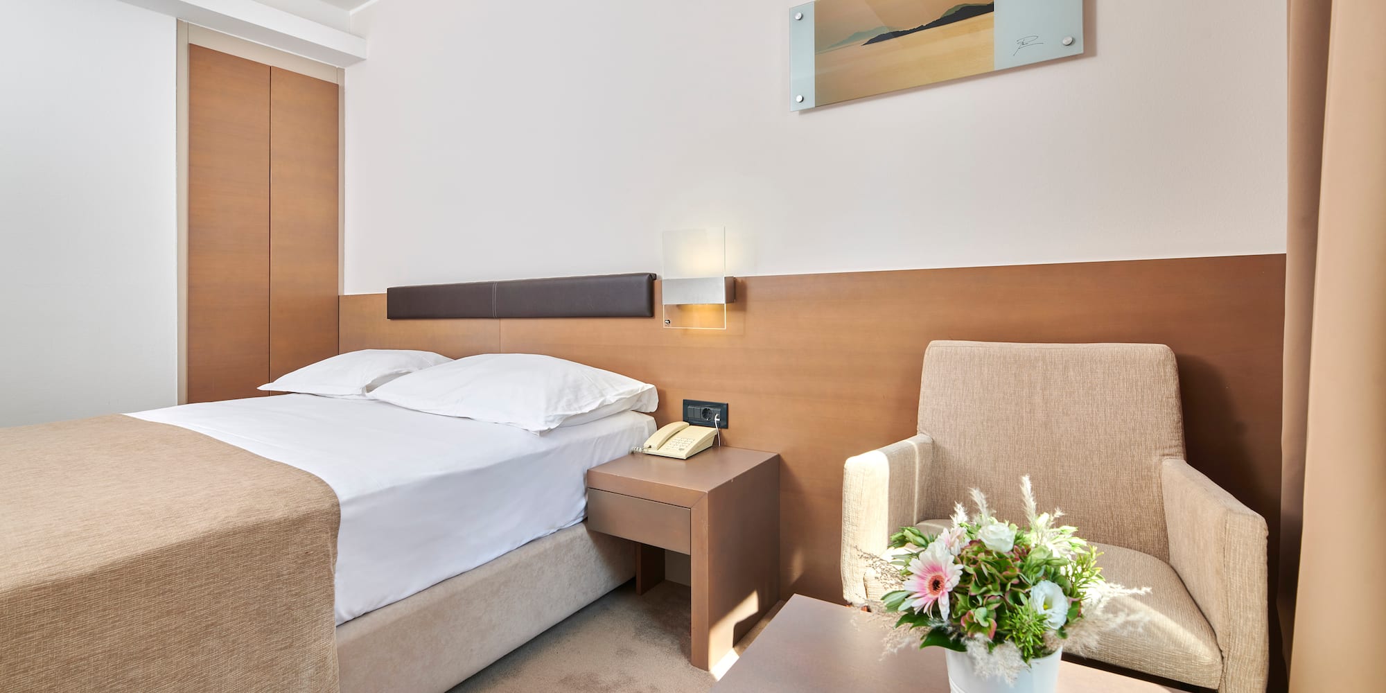 a room with a bed and a chair