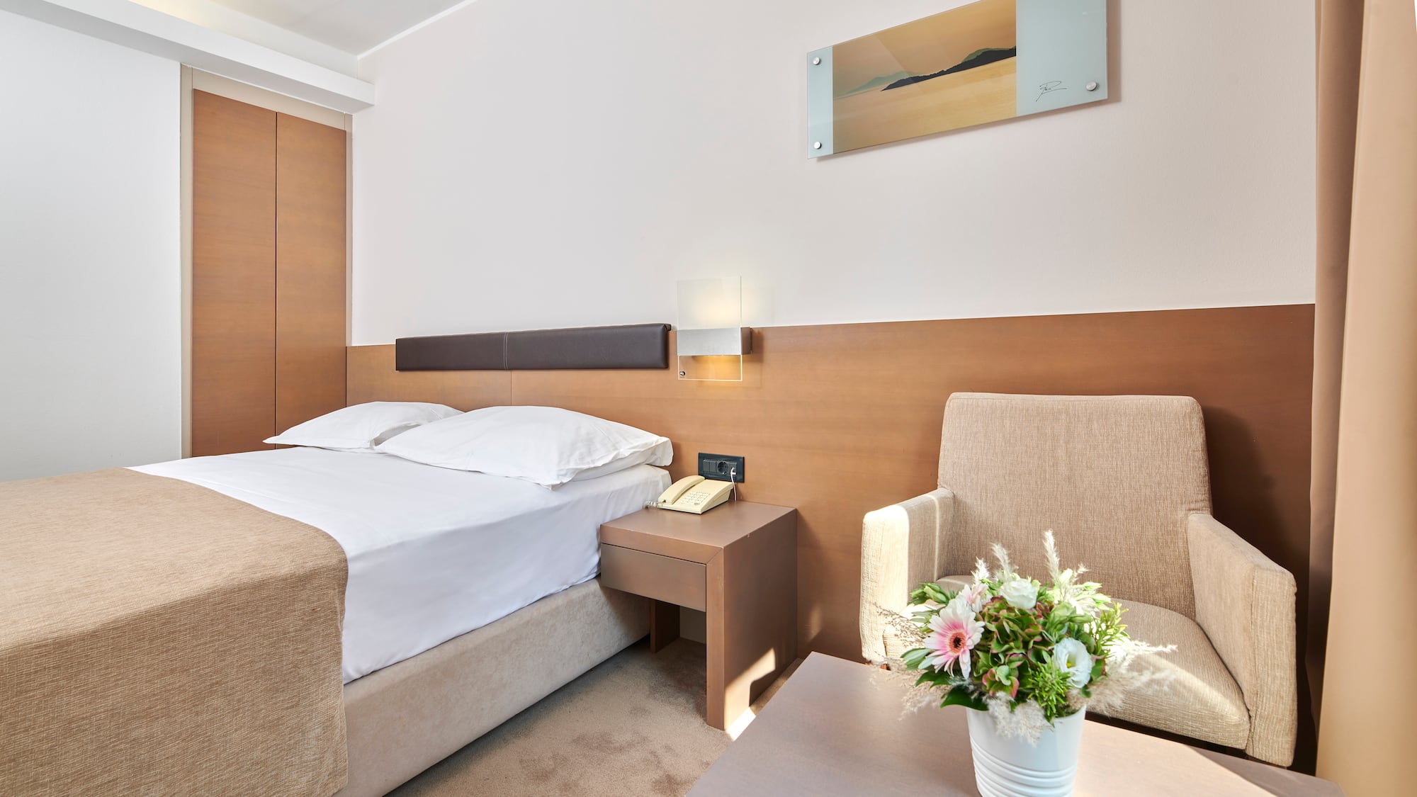 a room with a bed and a chair