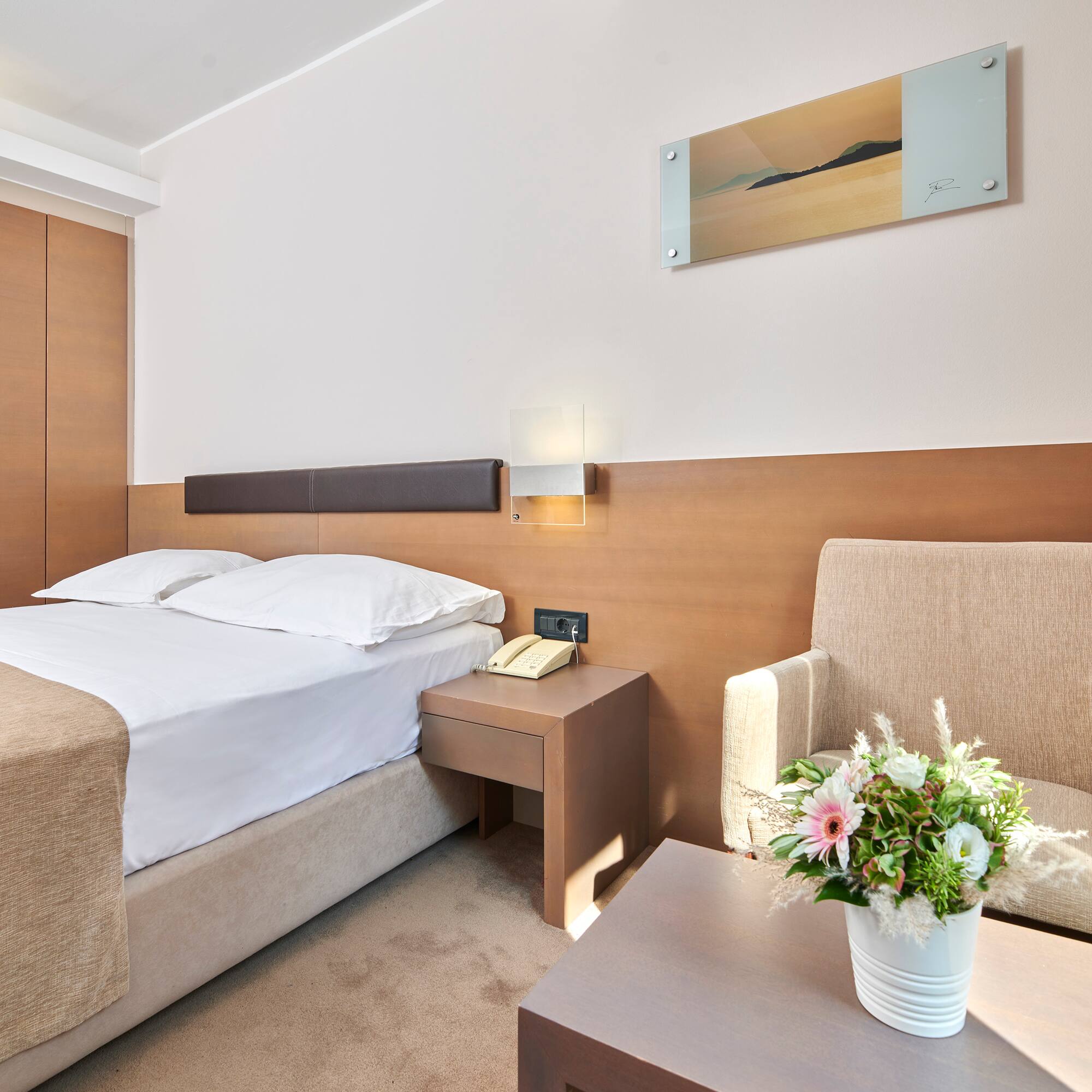 a room with a bed and a chair