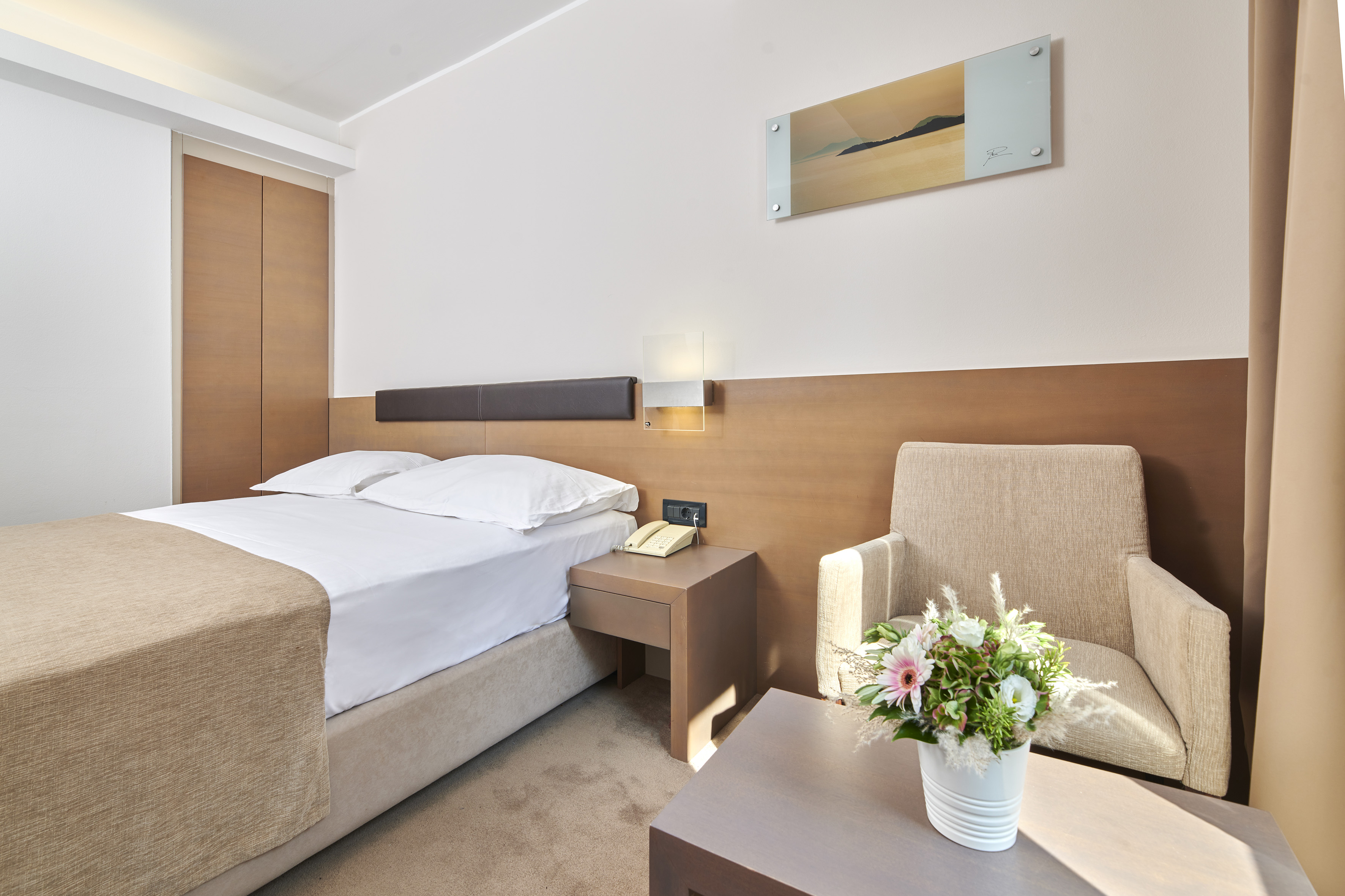 a room with a bed and a chair