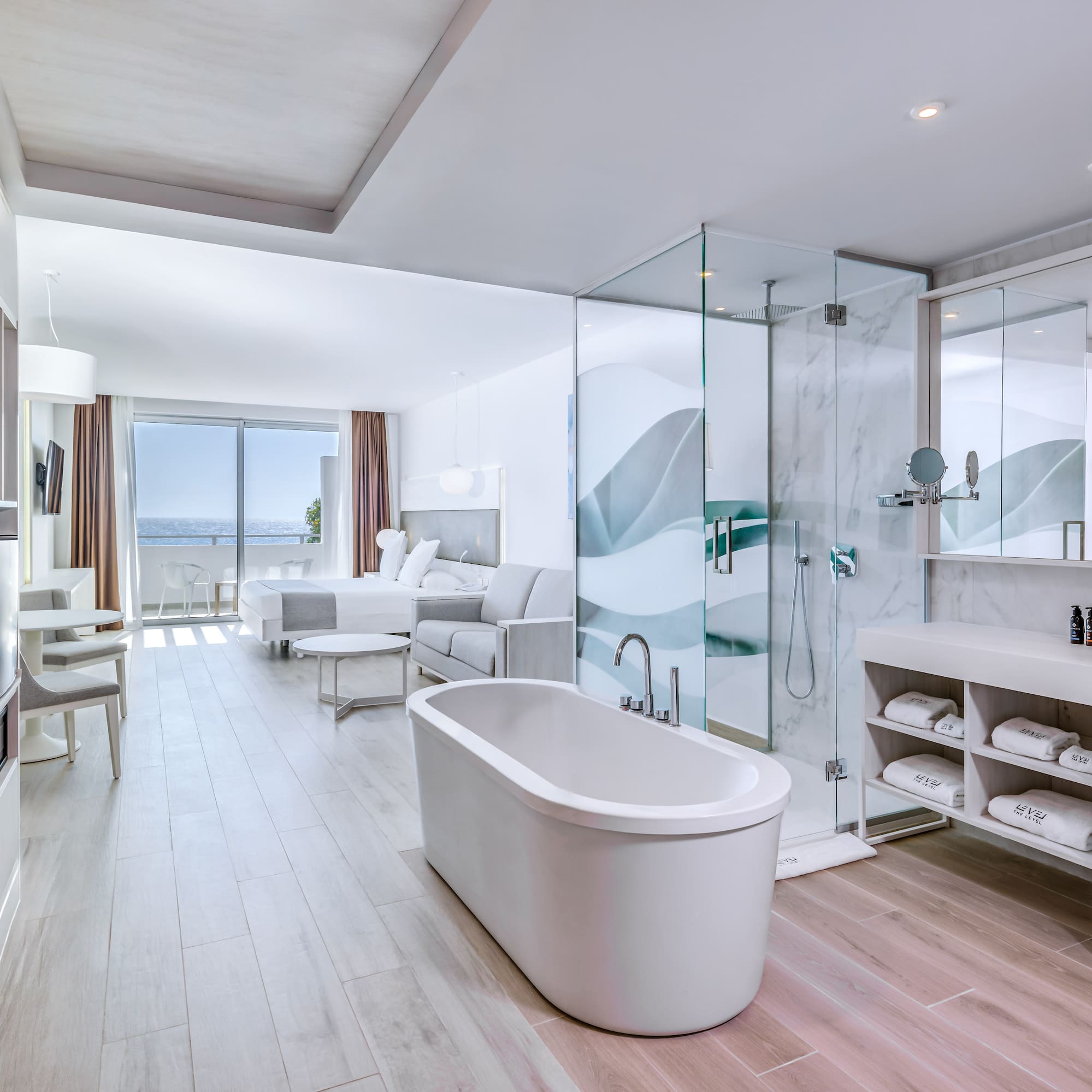 a bathroom with a tub and a shower