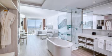 a bathroom with a tub and a shower