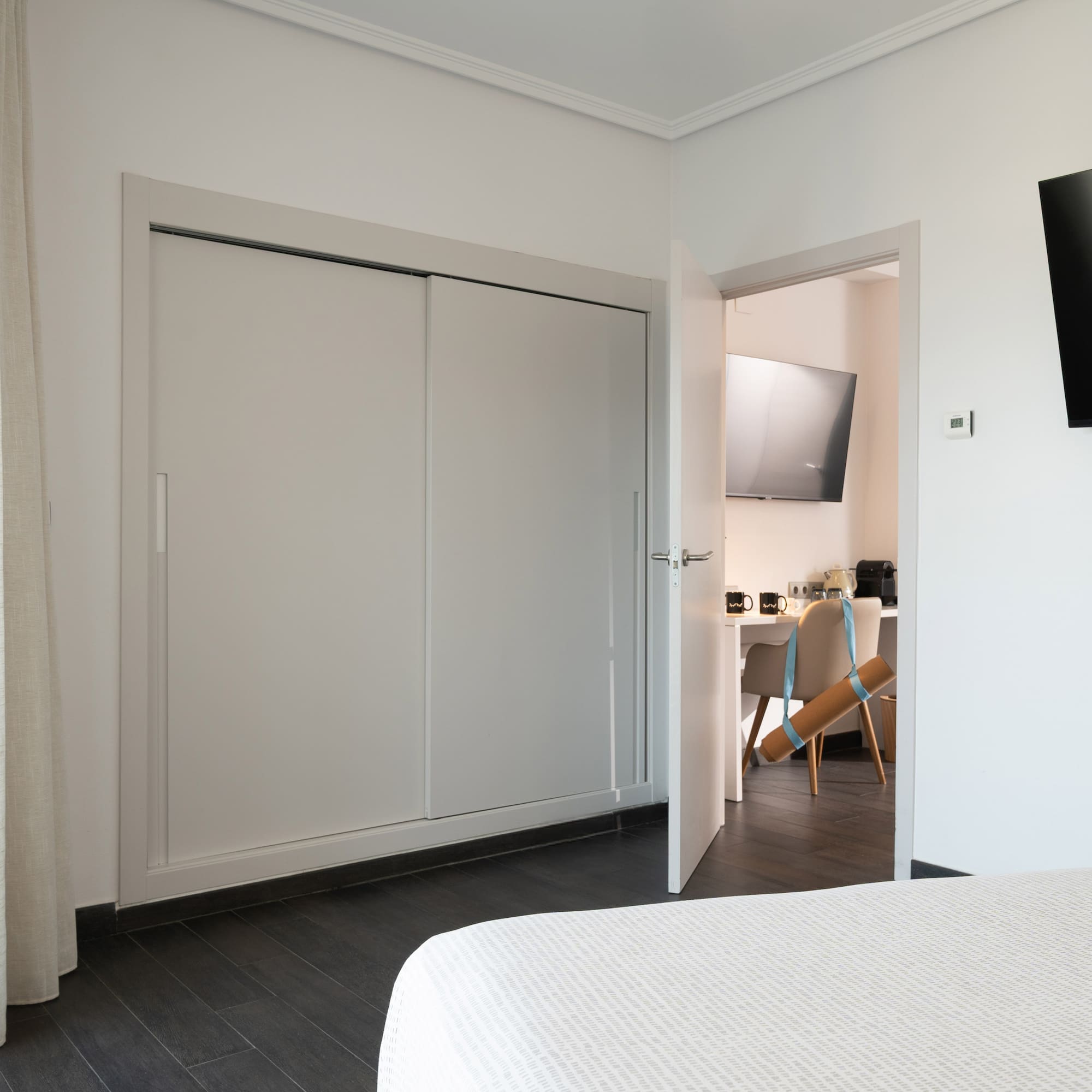 a room with a tv and a bed