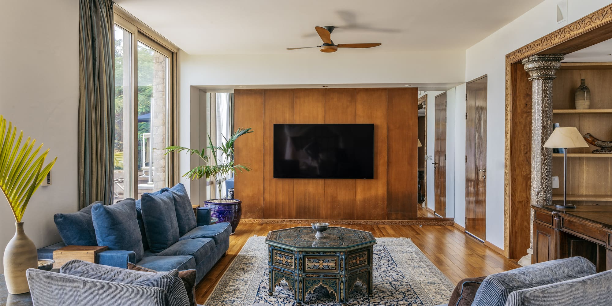 a living room with a television and couches