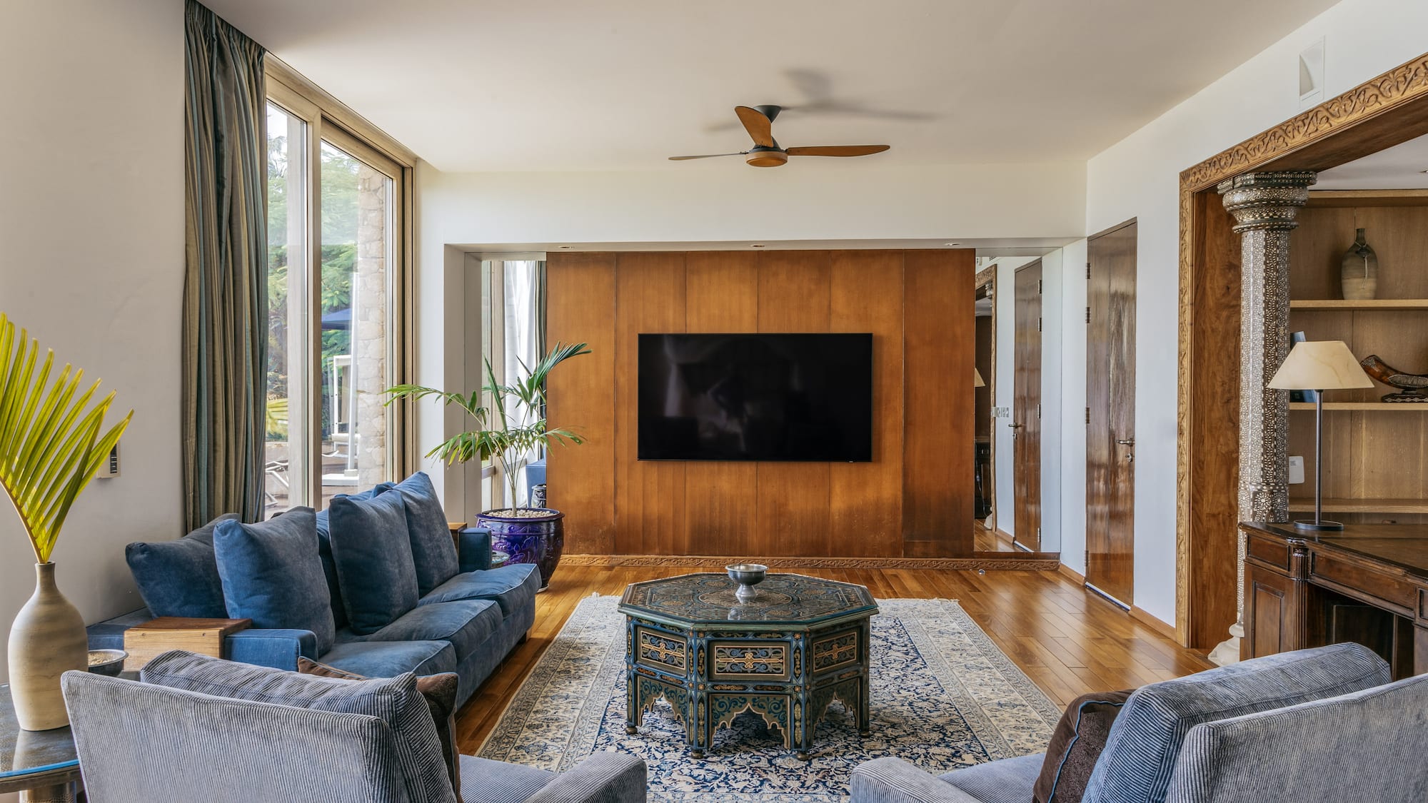a living room with a television and couches