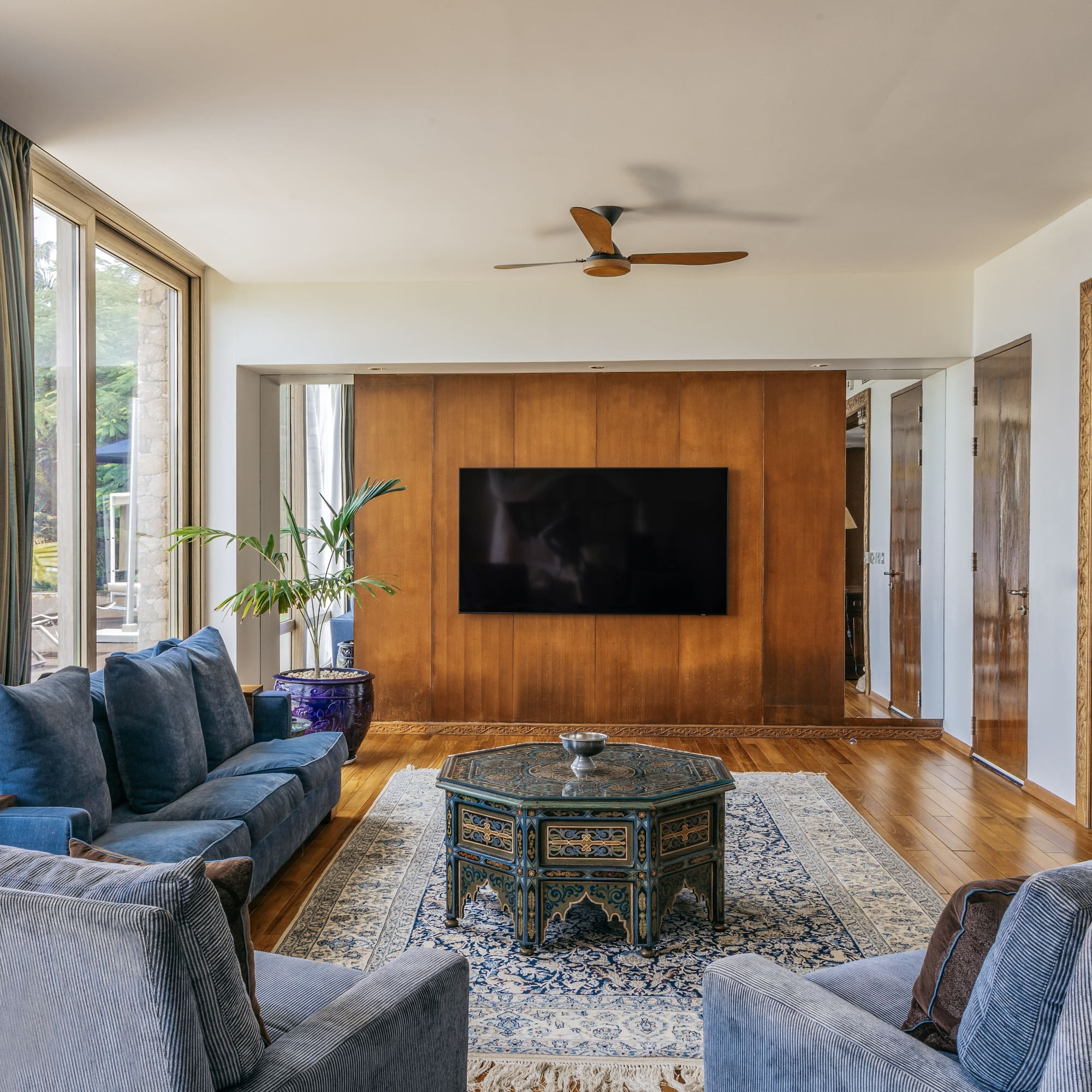 a living room with a television and couches