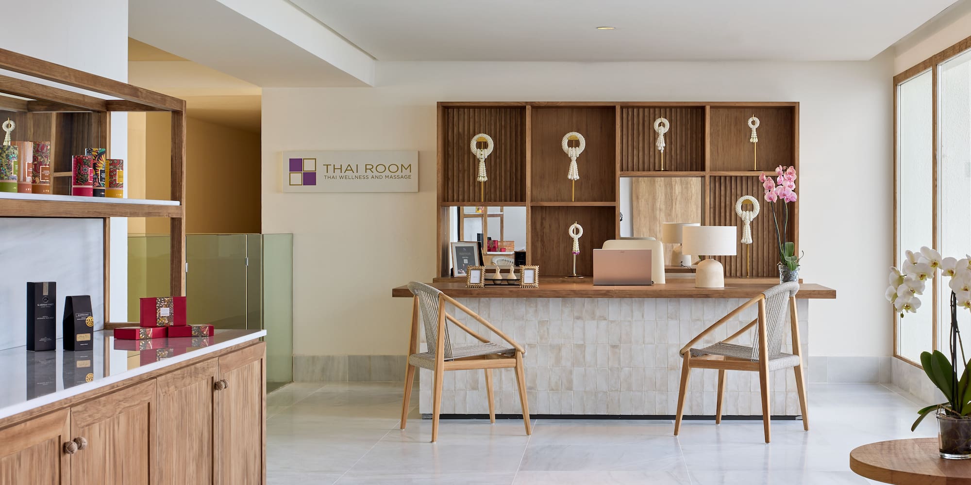 a room with a desk and chairs